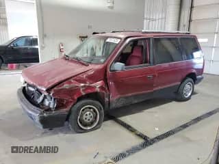 1989 Dodge Caravan with VIN 2B4FK553XKR379082, listed as a Copart auction lot 71077325 with 163,844 mi miles and Salvage title. Bid and sale history available at DreamBid. Image 1.