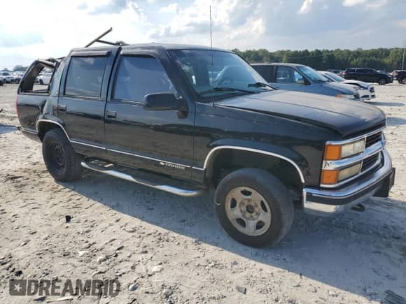 1999 Chevrolet Tahoe Z71 z VIN 1GNEK13R1XJ380316, wystawiony jako Copart lot #68505524 z przebiegiem 242 542 mil mil oraz Szkoda całkowita • Salvage title. Historia ofert i sprzedaży dostępna na DreamBid. Obrazek 4.