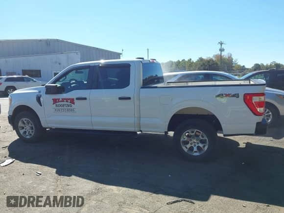 2022 Ford F-150 Lariat with VIN 1FTFW1E54NKD78840, listed as a IAAI auction lot 43418616 with 70,871 mi miles and . Bid and sale history available at DreamBid. Image 14.