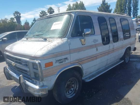 1989 Chevrolet Chevy Van with VIN 1GBEG25K5K7112900, listed as a IAAI auction lot 42931871 with 34,700 mi miles and . Bid and sale history available at DreamBid. Image 2.