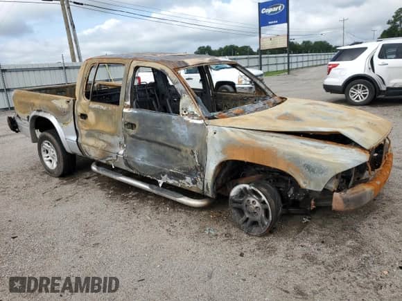 2003 Dodge Dakota Sport with VIN 1D7HG38N53S127292, listed as a Copart auction lot 62985315 with Not provided miles and Salvage title. Bid and sale history available at DreamBid. Image 4.