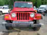 2000 Jeep Wrangler SE with VIN 1J4FA29P8YP711686, listed as a Copart auction lot 68999455 with 100,108 mi miles and Salvage title. Bid and sale history available at DreamBid. Image 5.