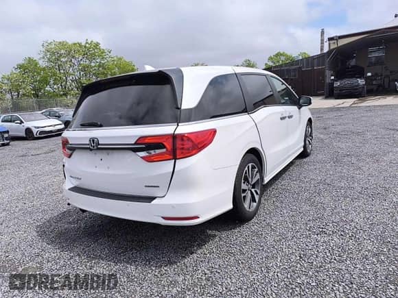 2023 Honda Odyssey Touring z VIN 5FNRL6H81PB008129, wystawiony jako Copart lot #90663075 z przebiegiem 57 273 mil mil oraz Czysty tytuł • Clean title. Historia ofert i sprzedaży dostępna na DreamBid. Obrazek 4.