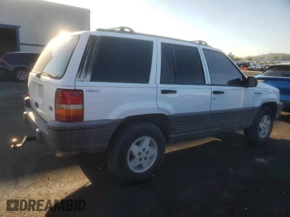 1995 Jeep Grand Cherokee Laredo with VIN 1J4GZ58Y6SC712472, listed as a Copart auction lot 80547635 with 214,089 mi miles and Salvage title. Bid and sale history available at DreamBid. Image 3.