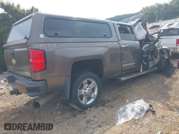 2015 Chevrolet Silverado 2500HD High Country with VIN 1GC1KXE8XFF614341, listed as a IAAI auction lot 43154911 with Not provided miles and . Bid and sale history available at DreamBid. Image 4.