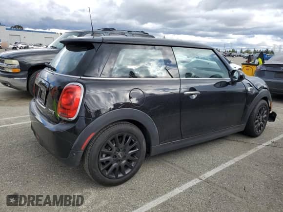 2019 MINI Hardtop Cooper with VIN WMWXP5C56K2H31697, listed as a Copart auction lot 48826655 with 60,190 mi miles and Salvage title. Bid and sale history available at DreamBid. Image 3.
