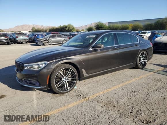 2016 BMW 7 Series 750i xDrive with VIN WBA7F2C5XGG415521, listed as a Copart auction lot 80483505 with 128,509 mi miles and Salvage title. Bid and sale history available at DreamBid. Image 1.