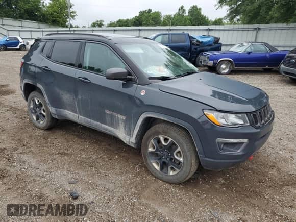 2017 Jeep Compass Trailhawk with VIN 3C4NJDDBXHT688190, listed as a Copart auction lot 63299085 with 104,758 mi miles and Clean title. Bid and sale history available at DreamBid. Image 4.