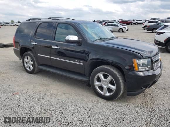 2014 Chevrolet Tahoe LTZ с VIN 1GNSKCE0XER228028, выставлен на аукционе Copart как лот 56971135 с пробегом 155 285 миль миль и Списание • Salvage title. История ставок и продаж доступна на DreamBid. Изображение 4.