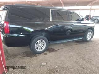 2019 Chevrolet Suburban LT with VIN 1GNSCHKCXKR127429, listed as a IAAI auction lot 43013423 with 112,893 mi miles and . Bid and sale history available at DreamBid. Image 4.