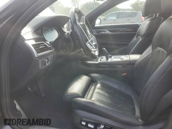 2019 BMW 7 Series 740i xDrive with VIN WBA7E4C55KGV70002, listed as a Copart auction lot 66395815 with 128,606 mi miles and Salvage title. Bid and sale history available at DreamBid. Image 7.