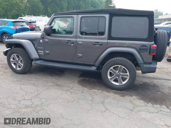 2021 Jeep Wrangler Unlimited Sahara Altitude with VIN 1C4HJXEG7MW776529, listed as a IAAI auction lot 42911866 with 51,748 mi miles and . Bid and sale history available at DreamBid. Image 14.