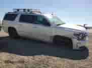 2015 Chevrolet Suburban LTZ with VIN 1GNSKKKC7FR303391, listed as a Copart auction lot 67794035 with 134,569 mi miles and Salvage title. Bid and sale history available at DreamBid. Image 4.