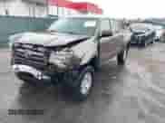 2010 Toyota Tacoma with VIN 3TMLU4EN1AM051034, listed as a IAAI auction lot 43020609 with 224,737 mi miles and . Bid and sale history available at DreamBid. Image 2.