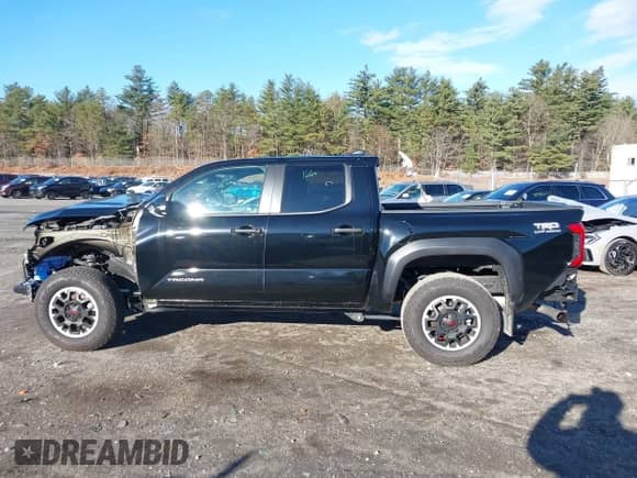 2024 Toyota Tacoma SR5 with VIN 3TMLB5JN0RM008463, listed as a IAAI auction lot 40979020 with 4,710 mi miles and . Bid and sale history available at DreamBid. Image 15.