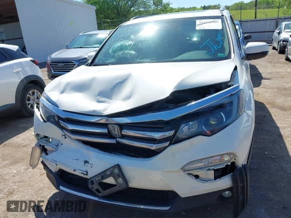 2018 Honda Pilot Touring с VIN 5FNYF6H95JB001137, выставлен на аукционе IAAI как лот 42146265 с пробегом 112 163 миль миль и . История ставок и продаж доступна на DreamBid. Изображение 12.