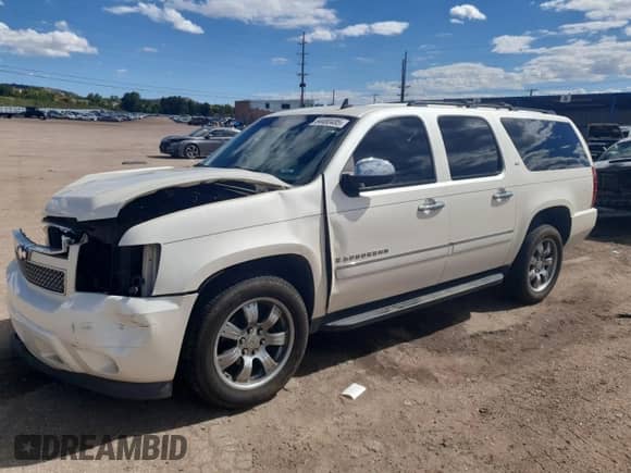 2009 Chevrolet Suburban LTZ with VIN 1GNFK36319R170097, listed as a Copart auction lot 84480485 with 257,990 mi miles and Salvage title. Bid and sale history available at DreamBid. Image 1.