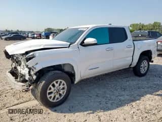2024 Toyota Tacoma SR5 with VIN 3TMKB5FN2RM022658, listed as a Copart auction lot 84005005 with 20,711 mi miles and Salvage title. Bid and sale history available at DreamBid. Image 1.
