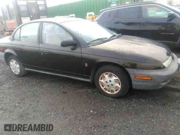 1996 Saturn SL z VIN 1G8ZH5285TZ165343, wystawiony jako IAAI lot #39067128 z przebiegiem 88 380 mil mil oraz . Historia ofert i sprzedaży dostępna na DreamBid. Obrazek 1.