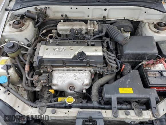 2005 Hyundai Accent GLS z VIN KMHCG45C45U631414, wystawiony jako Copart lot #73963814 z przebiegiem 106 617 mil mil oraz Szkoda całkowita • Salvage title. Historia ofert i sprzedaży dostępna na DreamBid. Obrazek 13.