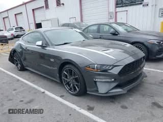 2020 Ford Mustang EcoBoost z VIN 1FA6P8TD4L5124725, wystawiony jako IAAI lot #42662428 z przebiegiem 74 845 mil mil oraz . Historia ofert i sprzedaży dostępna na DreamBid. Obrazek 1.