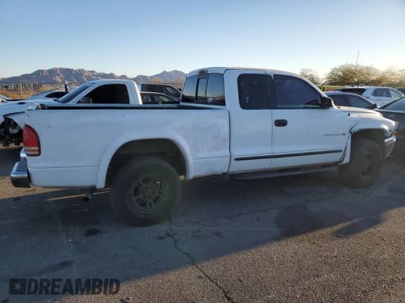 1998 Dodge Dakota SLT z VIN 1B7GG22Y1WS544271, wystawiony jako Copart lot #88781885 z przebiegiem 149 417 mil mil oraz Szkoda całkowita • Salvage title. Historia ofert i sprzedaży dostępna na DreamBid. Obrazek 3.