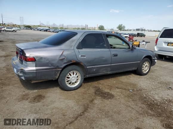1997 Toyota Camry LE с VIN 4T1BG22K8VU142834, выставлен на аукционе Copart как лот 69954185 с пробегом 178 619 миль миль и Списание • Salvage title. История ставок и продаж доступна на DreamBid. Изображение 3.