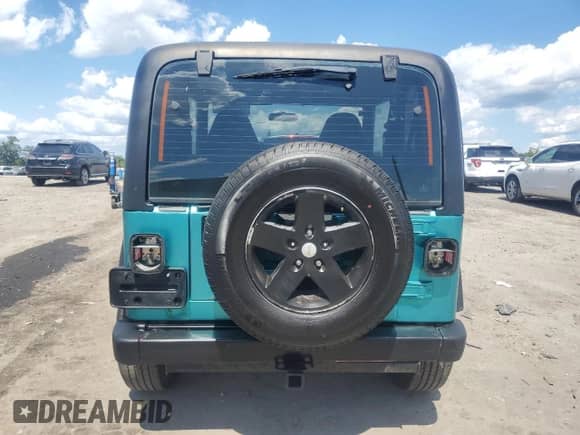 2002 Jeep Wrangler X z VIN 1J4FA39SX2P731469, wystawiony jako Copart lot #71106525 z przebiegiem 199 317 mil mil oraz Czysty tytuł • Clean title. Historia ofert i sprzedaży dostępna na DreamBid. Obrazek 6.