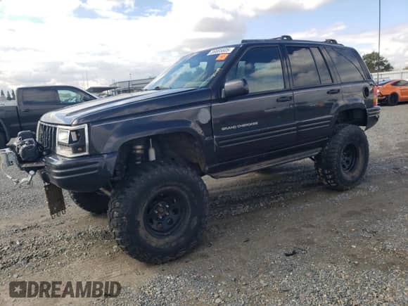 1998 Jeep Grand Cherokee Limited с VIN 1J4GZ78Y4WC312654, выставлен на аукционе Copart как лот 86685605 с пробегом 187 978 миль миль и Чистый • Clean title. История ставок и продаж доступна на DreamBid. Изображение 1.