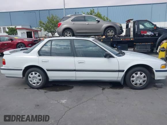 1990 Honda Accord LX with VIN JHMCB7652LC067333, listed as a IAAI auction lot 42580921 with 119,733 mi miles and . Bid and sale history available at DreamBid. Image 13.