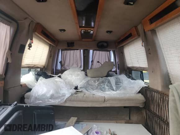 1996 Chevrolet Chevy Van с VIN 1GBFG15M1T1001653, выставлен на аукционе Copart как лот 84589274 с пробегом Не указан миль и На запчасти • Non repairable. История ставок и продаж доступна на DreamBid. Изображение 10.