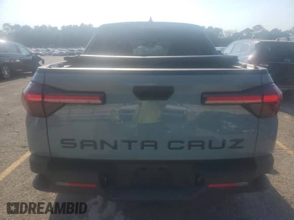 2022 Hyundai Santa Cruz SEL z VIN 5NTJBDAE6NH031670, wystawiony jako Copart lot #80614685 z przebiegiem 59 850 mil mil oraz Czysty tytuł • Clean title. Historia ofert i sprzedaży dostępna na DreamBid. Obrazek 6.