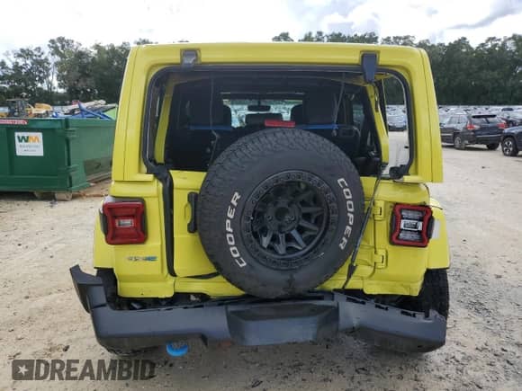 2023 Jeep Wrangler Sahara with VIN 1C4JJXP65PW505043, listed as a Copart auction lot 71843055 with 63,479 mi miles and Salvage title. Bid and sale history available at DreamBid. Image 6.