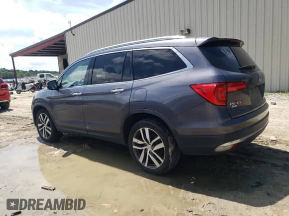 2018 Honda Pilot Touring z VIN 5FNYF6H99JB069585, wystawiony jako Copart lot #64240475 z przebiegiem 141 975 mil mil oraz Szkoda całkowita • Salvage title. Historia ofert i sprzedaży dostępna na DreamBid. Obrazek 2.