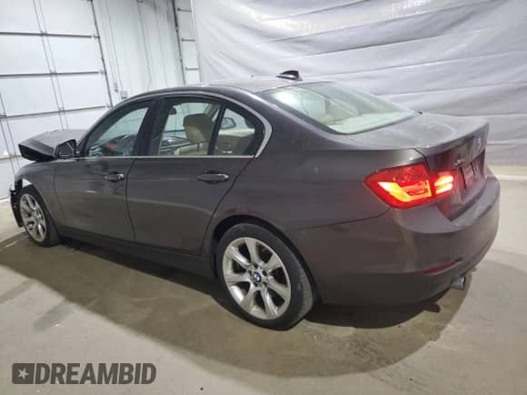 2015 BMW 3 Series 335i xDrive with VIN WBA3B9G57FNR99402, listed as a Copart auction lot 70015545 with 127,455 mi miles and Salvage title. Bid and sale history available at DreamBid. Image 2.
