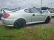 2003 Hyundai Tiburon GT с VIN KMHHN65F93U019840, выставлен на аукционе Copart как лот 74063394 с пробегом Не указан миль и На запчасти • Non repairable. История ставок и продаж доступна на DreamBid. Изображение 3.