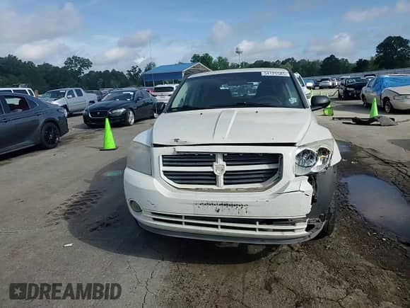 2008 Dodge Caliber SXT with VIN 1B3HB48C48D590860, listed as a Copart auction lot 54125585 with 242,177 mi miles and Salvage title. Bid and sale history available at DreamBid. Image 14.