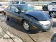 2001 Saturn SC with VIN 1G8ZR12721Z295252, listed as a Copart auction lot 82608074 with 137,076 mi miles and Salvage title. Bid and sale history available at DreamBid. Image 4.