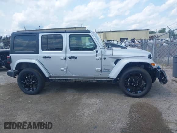 2023 Jeep Wrangler Sahara with VIN 1C4JJXP69PW695915, listed as a IAAI auction lot 42662028 with 36,957 mi miles and . Bid and sale history available at DreamBid. Image 13.