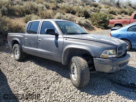 2002 Dodge Dakota с VIN 1B7HG38ZX2S711196, выставлен на аукционе Copart как лот 62605094 с пробегом Не указан миль и Списание • Salvage title. История ставок и продаж доступна на DreamBid. Изображение 4.