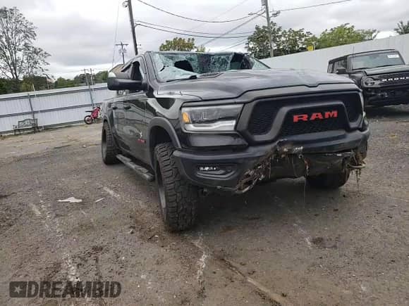 2019 Ram 1500 Rebel z VIN 1C6SRFLT2KN569288, wystawiony jako Copart lot #69744745 z przebiegiem Nie podano mil oraz Szkoda całkowita • Salvage title. Historia ofert i sprzedaży dostępna na DreamBid. Obrazek 14.
