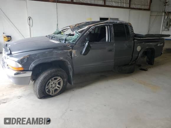 2003 Dodge Dakota SLT z VIN 1D7HG48N63S296100, wystawiony jako Copart lot #68014165 z przebiegiem Nie podano mil oraz Szkoda całkowita • Salvage title. Historia ofert i sprzedaży dostępna na DreamBid. Obrazek 1.