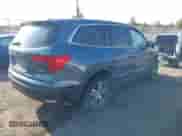 2016 Honda Pilot EX-L with VIN 5FNYF6H59GB125482, listed as a IAAI auction lot 43246080 with 132,677 mi miles and . Bid and sale history available at DreamBid. Image 4.