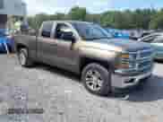 2015 Chevrolet Silverado 1500 LT z VIN 1GCVKREC2FZ177483, wystawiony jako IAAI lot #43222497 z przebiegiem 124 438 mil mil oraz . Historia ofert i sprzedaży dostępna na DreamBid. Obrazek 1.