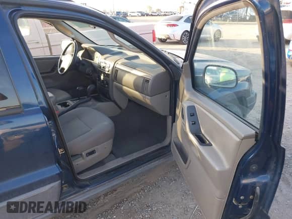 2002 Jeep Grand Cherokee Sport with VIN 1J4GW38S32C181840, listed as a IAAI auction lot 43237876 with 157,878 mi miles and . Bid and sale history available at DreamBid. Image 5.