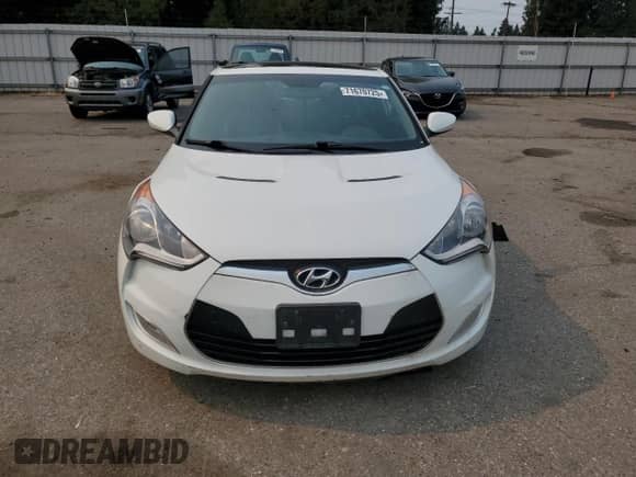 2014 Hyundai Veloster z VIN KMHTC6ADXEU187204, wystawiony jako Copart lot #71670725 z przebiegiem 94 917 mil mil oraz Czysty tytuł • Clean title. Historia ofert i sprzedaży dostępna na DreamBid. Obrazek 5.