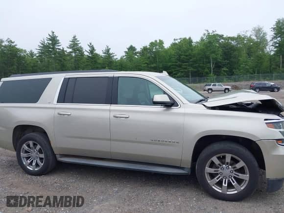 2015 Chevrolet Suburban LT with VIN 1GNSKJKC5FR569101, listed as a IAAI auction lot 42631110 with 183,729 mi miles and . Bid and sale history available at DreamBid. Image 13.