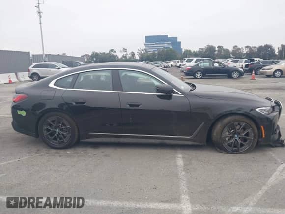 2023 BMW i4 eDrive35 with VIN WBY43AW04PFP93864, listed as a IAAI auction lot 42409885 with 19,758 mi miles and . Bid and sale history available at DreamBid. Image 13.