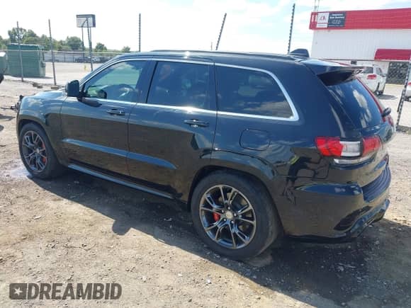 2015 Jeep Grand Cherokee SRT with VIN 1C4RJFDJ4FC853745, listed as a IAAI auction lot 43327828 with 68,614 mi miles and . Bid and sale history available at DreamBid. Image 3.