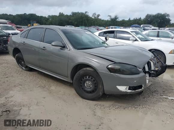 2012 Chevrolet Impala Police Police with VIN 2G1WD5E3XC1162170, listed as a Copart auction lot 70986324 with 148,208 mi miles and Salvage title. Bid and sale history available at DreamBid. Image 4.
